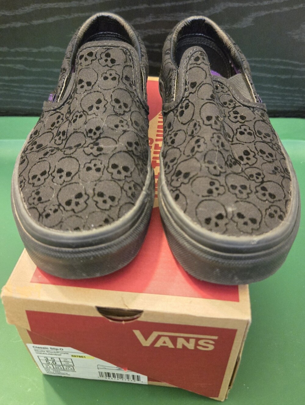 Vans Black Slip-On Sneakers with Flocked Skull Pattern